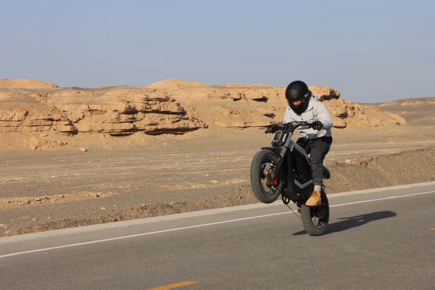 At the push of a button, it'll work with you to make wheelies a breeze