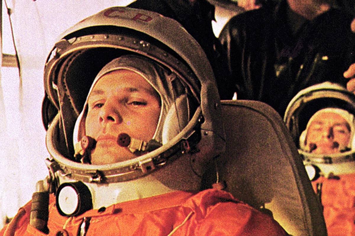 Yuri Gagarin with backup cosmonaut with Gherman Titov sitting behind him