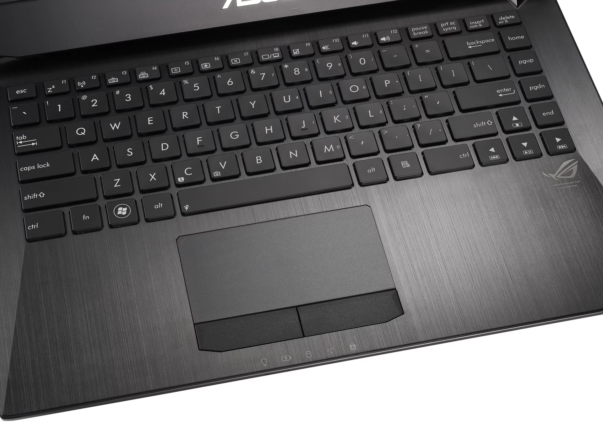 The keyboard and touchpad are surrounded by a single piece of brushed aluminum that tapers slightly toward the user