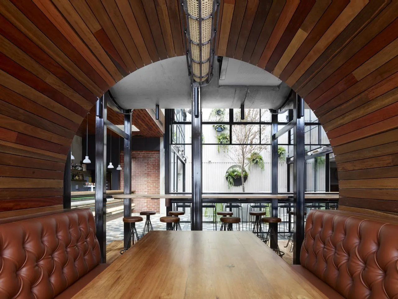 Concrete booths offers patrons large porthole-like views and an intimate dining experience