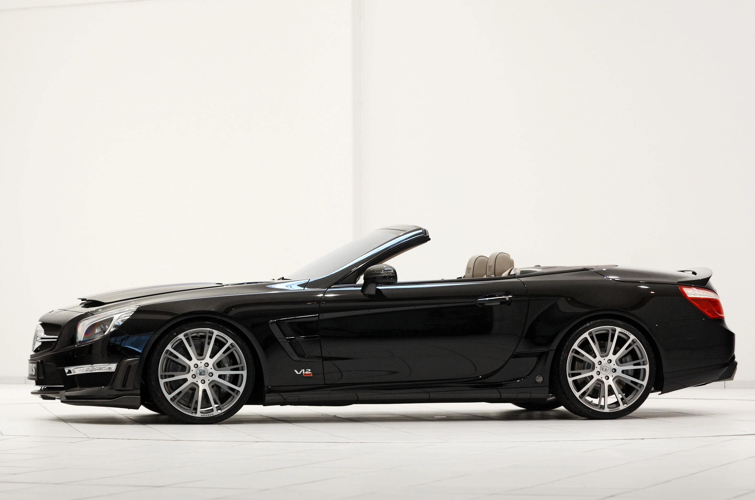 The functional hood scoop helps force-feed the V12's four air-water intercoolers