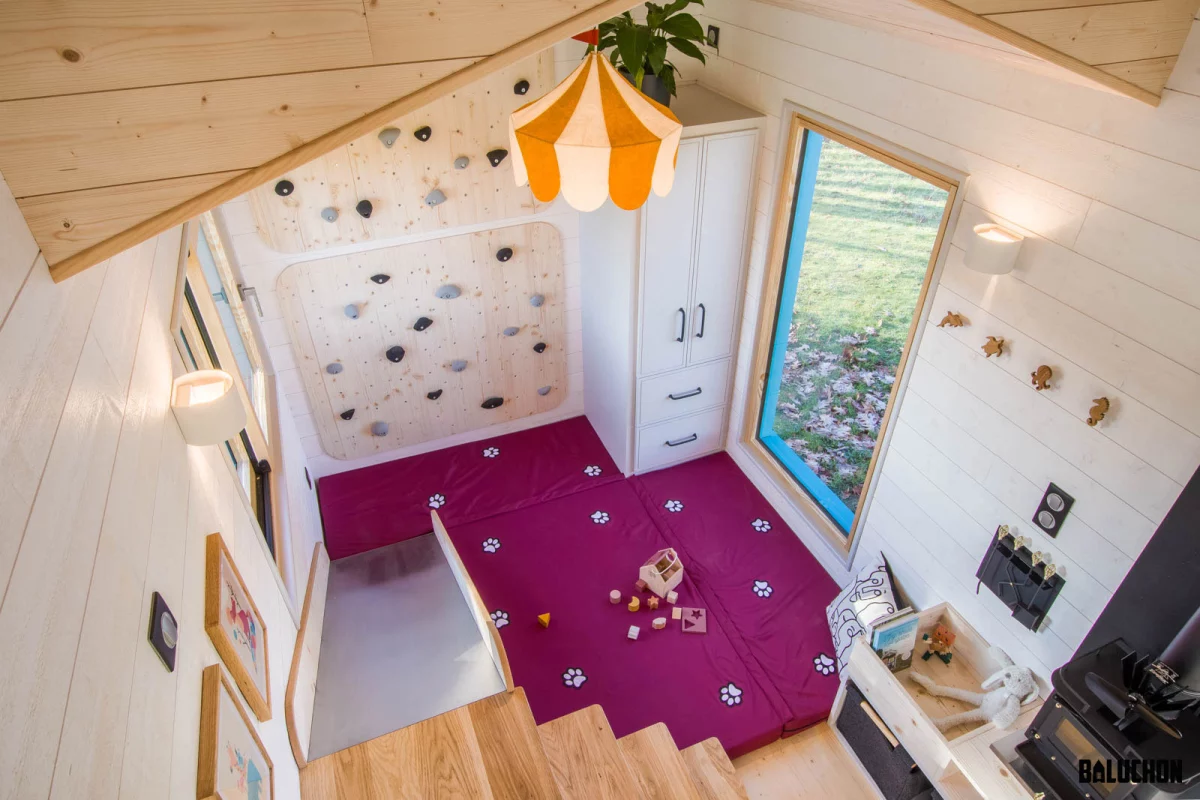 In the spot where you'd usually expect the living room to be, La Maison du Bonheur features a fun playroom with slide and climbing wall
