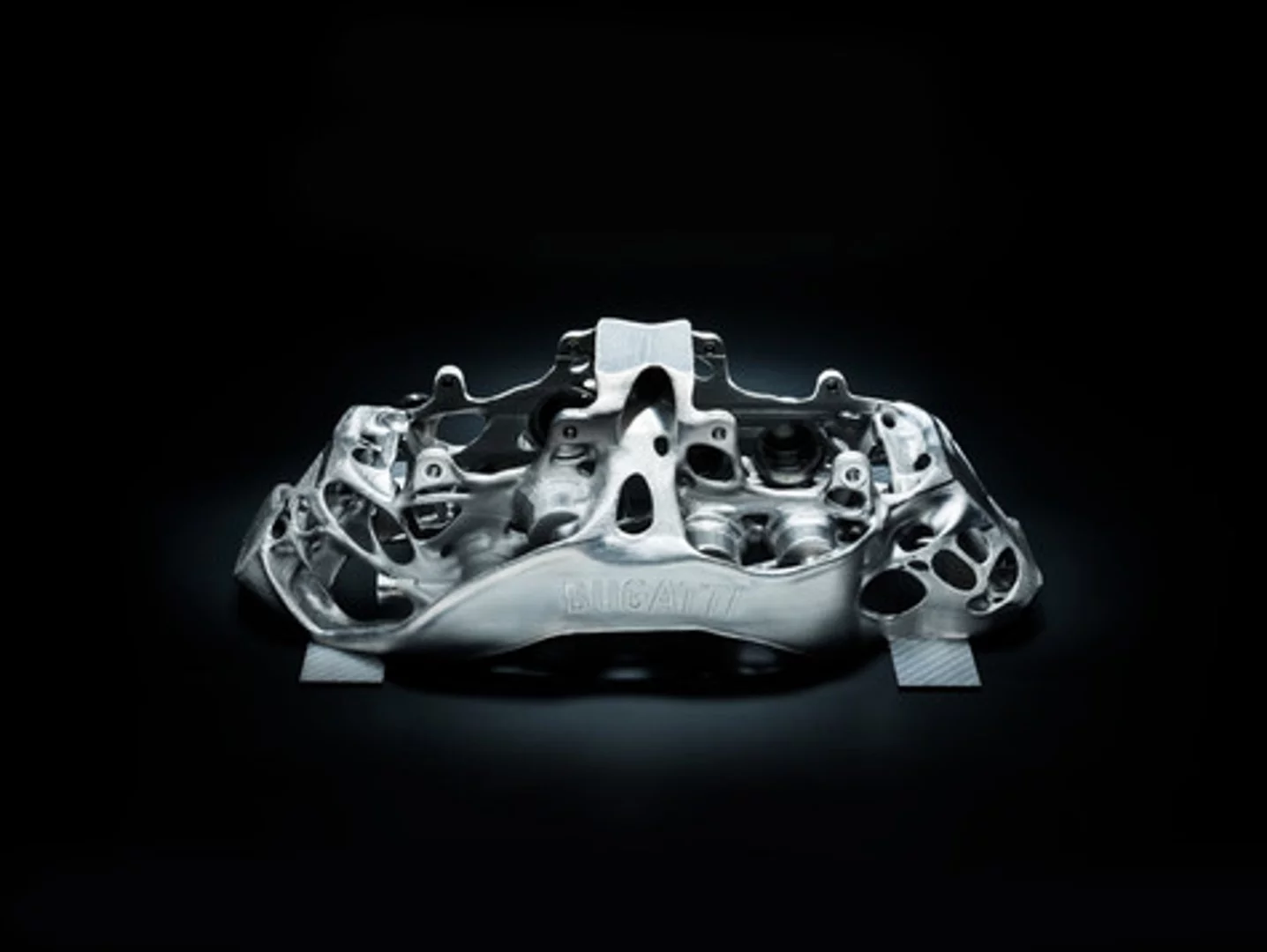 This eight-piston monobloc brake caliper developed by Bugatti is the world’s first brake caliper to be produced by 3-D printer