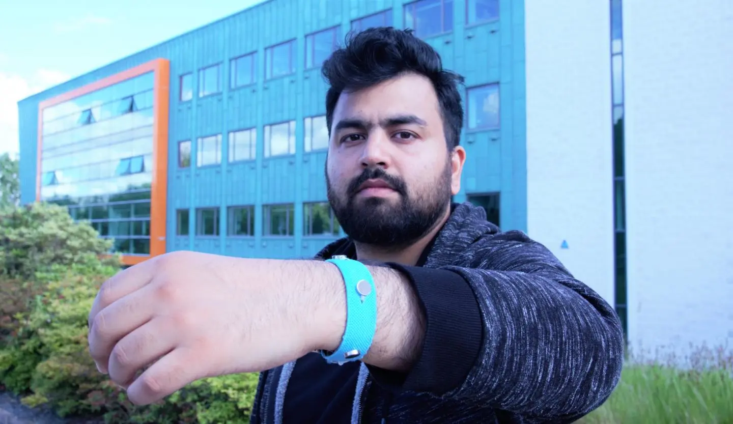 Co-creator Muhammad Umair wearing one of the prototype wristbands