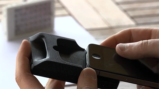 The Kick, which can hold an iPhone in a slot on the rear while leaving the camera lens exposed