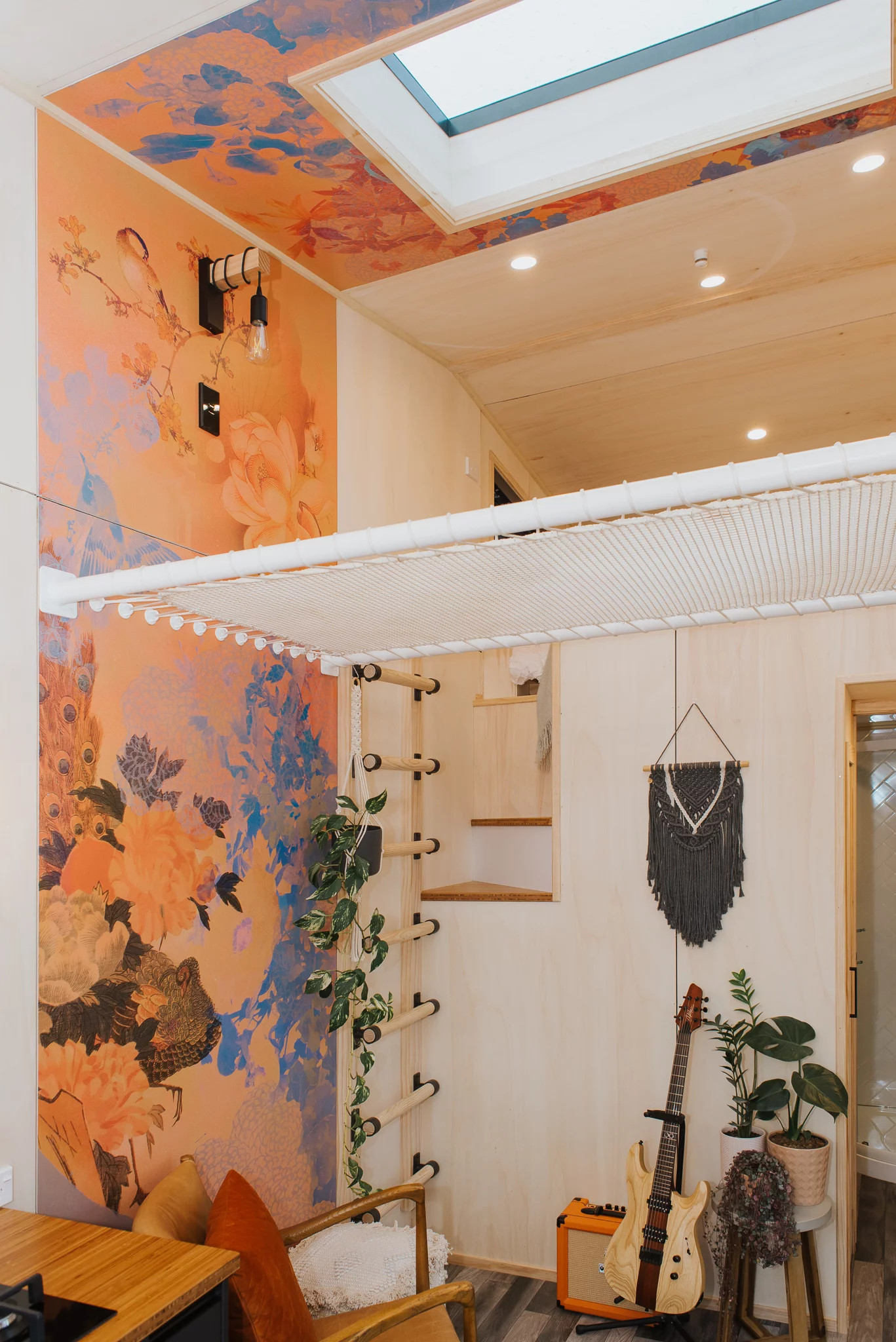 The Autumn's hammock net is reached by ladder. The ladder also provides access to the half-staircase that reaches the loft