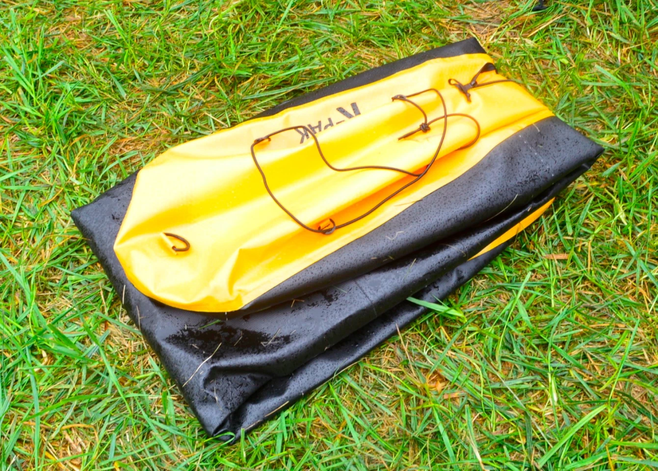 The K-Pak folds up in thirds and packs into the accompanying backpack