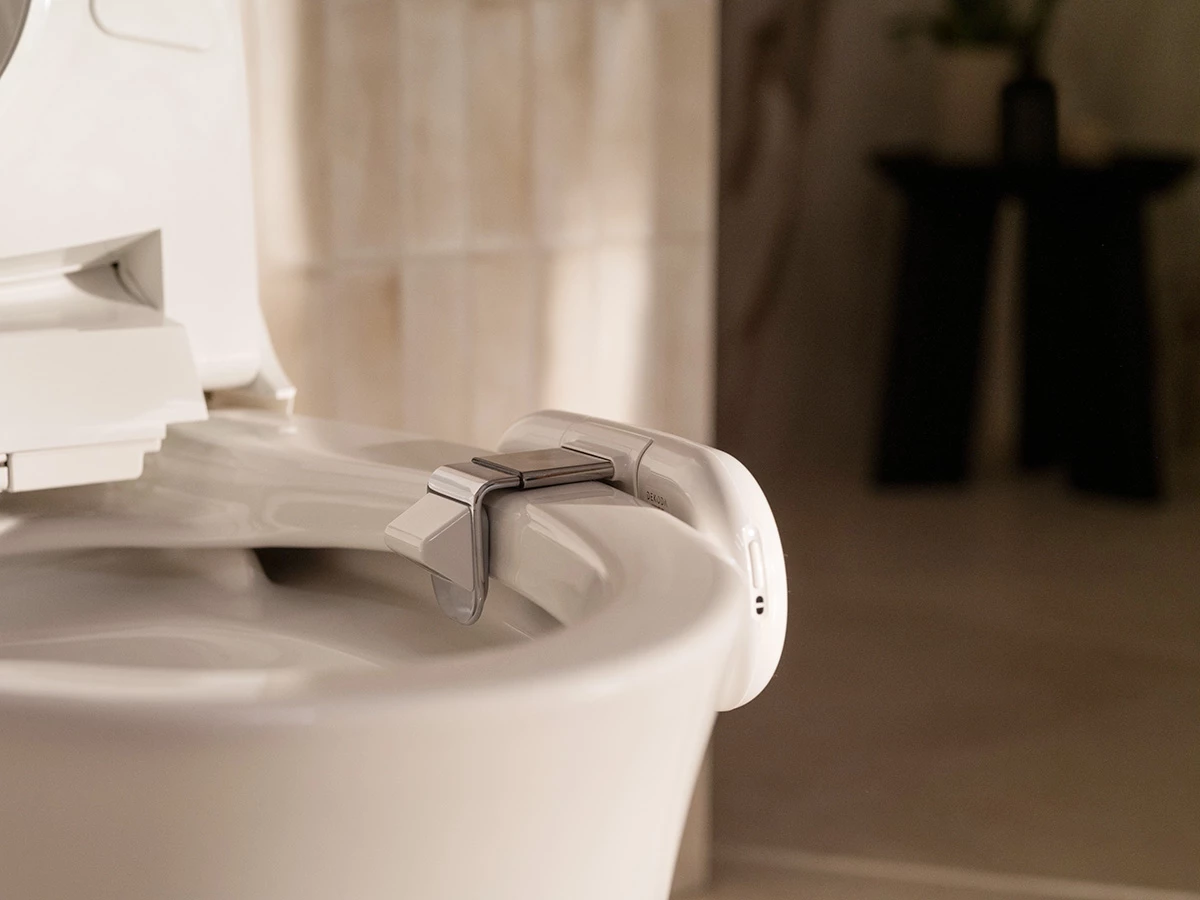 The Dekoda clamps on to the side of most toilet bowls - interestingly, it won't work with dark colored commodes
