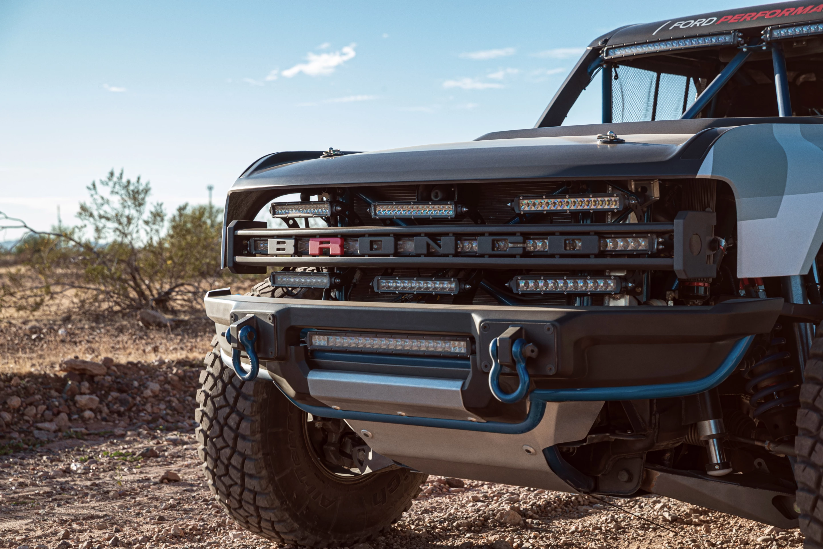 Ford puts the Bronco branding right in the grille, with a contrast "R" to show the model's prototype racing status