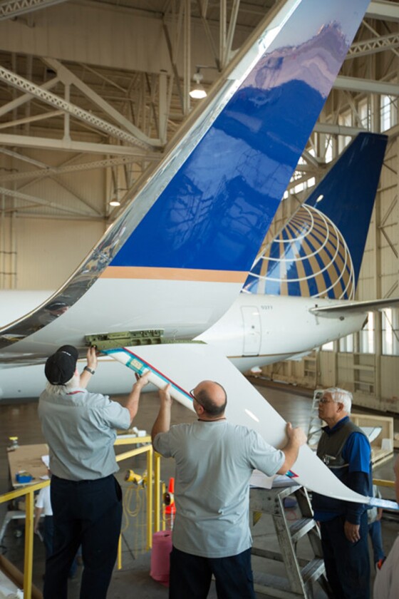 Retrofittting Blended Winglets to Split Scimitars involves adding strengthening spars, aerodynamic "scimitar tips," and a large ventral strake