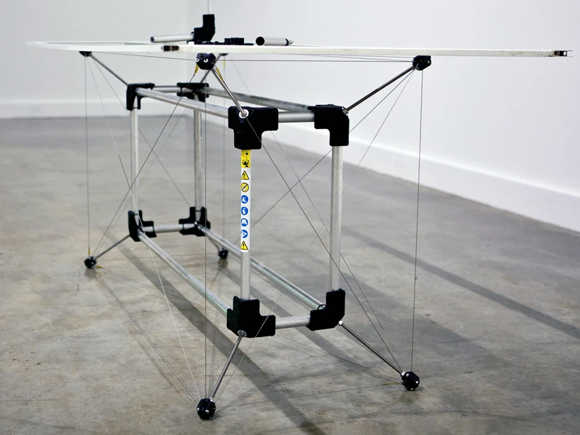 The table is made from discarded whipper snipper shafts and a glass shower screen