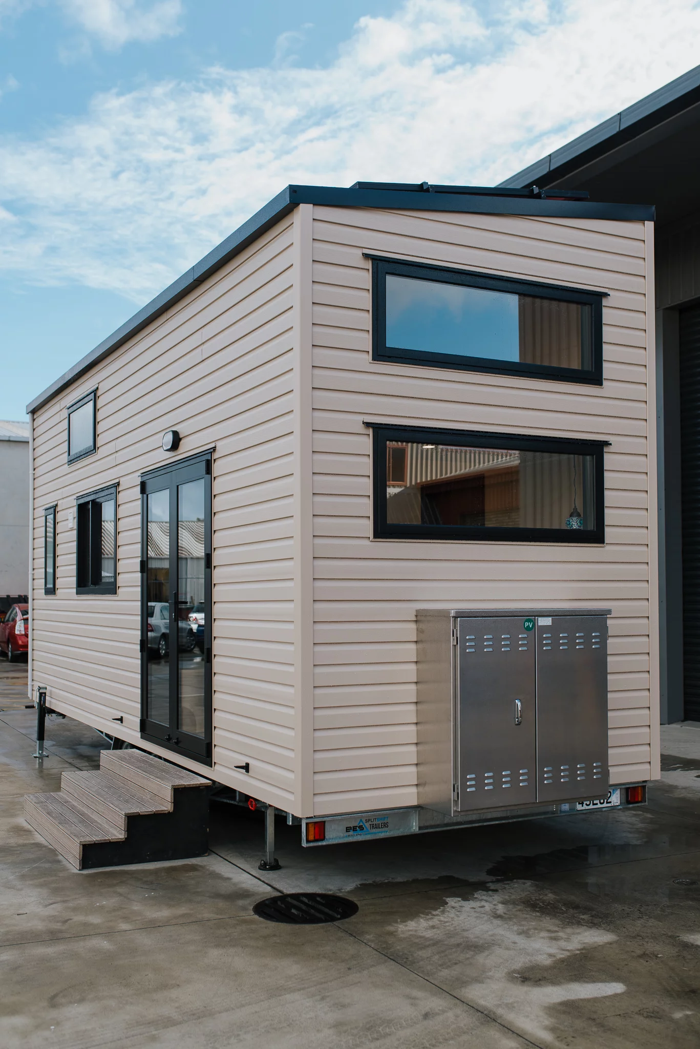 The Daisy Vera Tiny House's off-grid batteries are stored in an external storage box