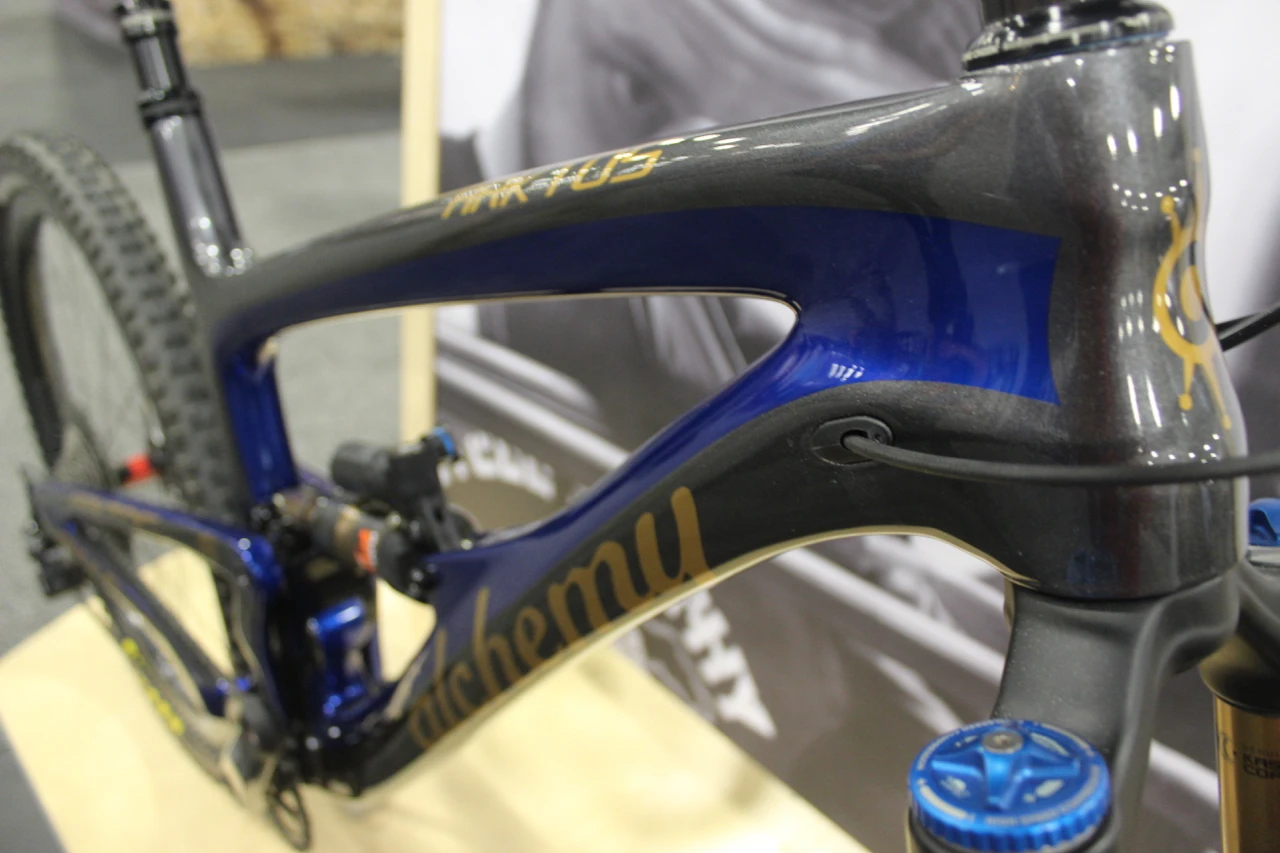 Attractive two-tone charcoal/blue paint job on this full-suspension mountain bike from Alchemy