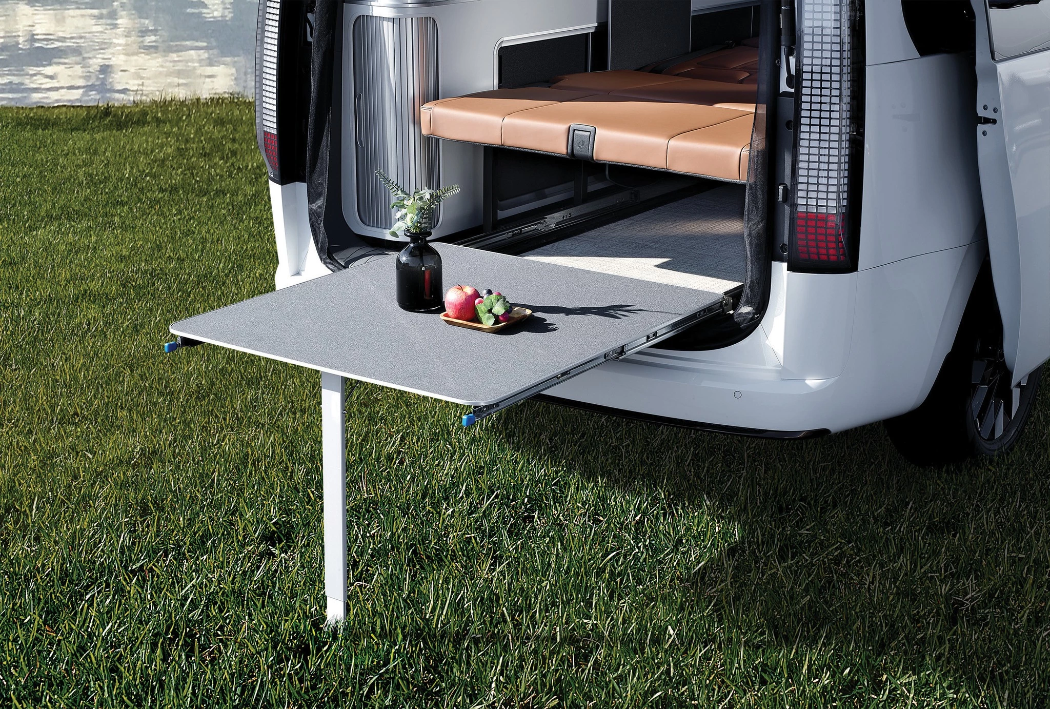 The slide-out table creates a seamless tailgate dining area and work space