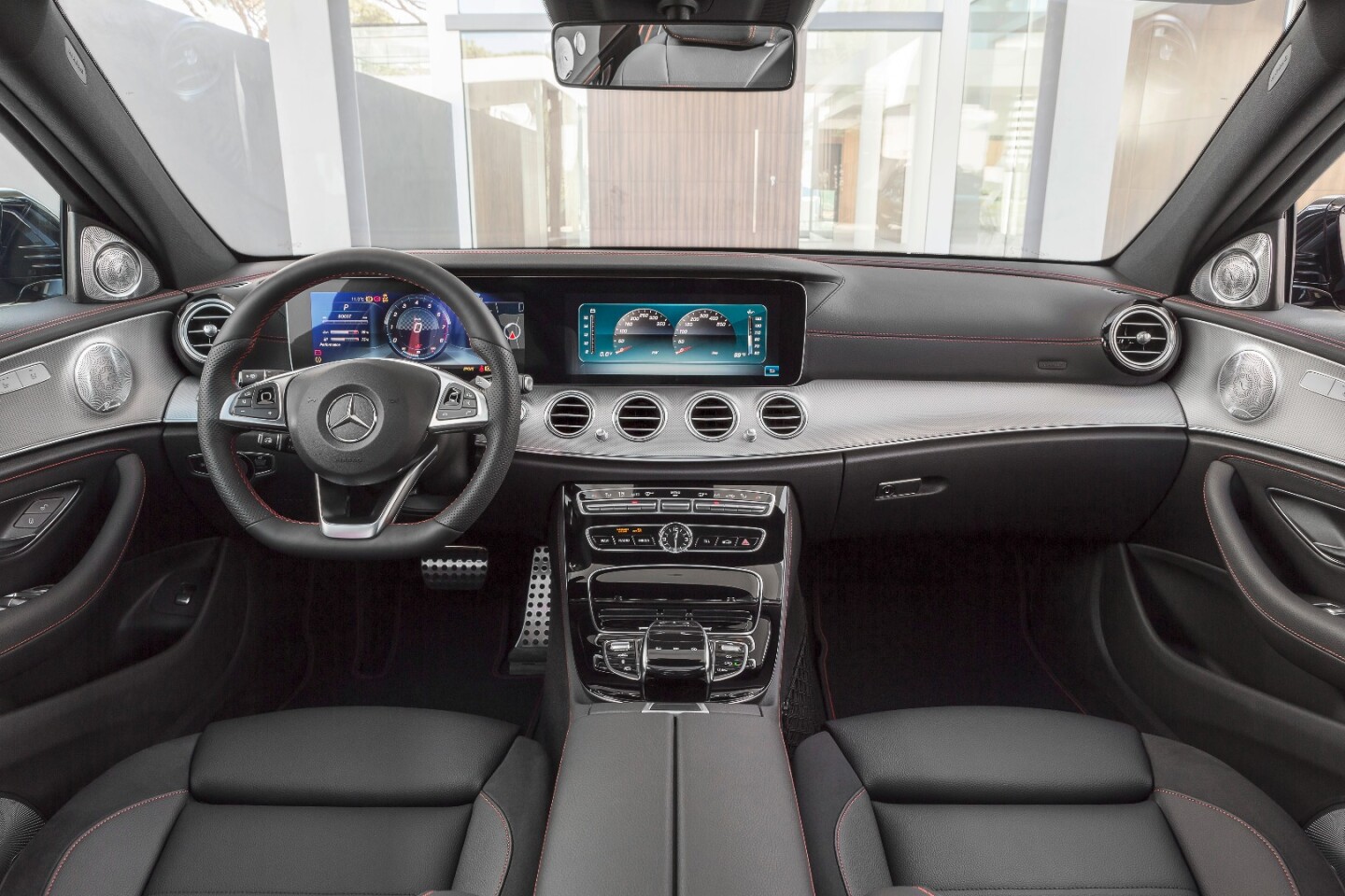 Exclusive sport seating, upholstery stitching, exclusive race pedals, and red seatbelts are some of the signs that this is an AMG-built car