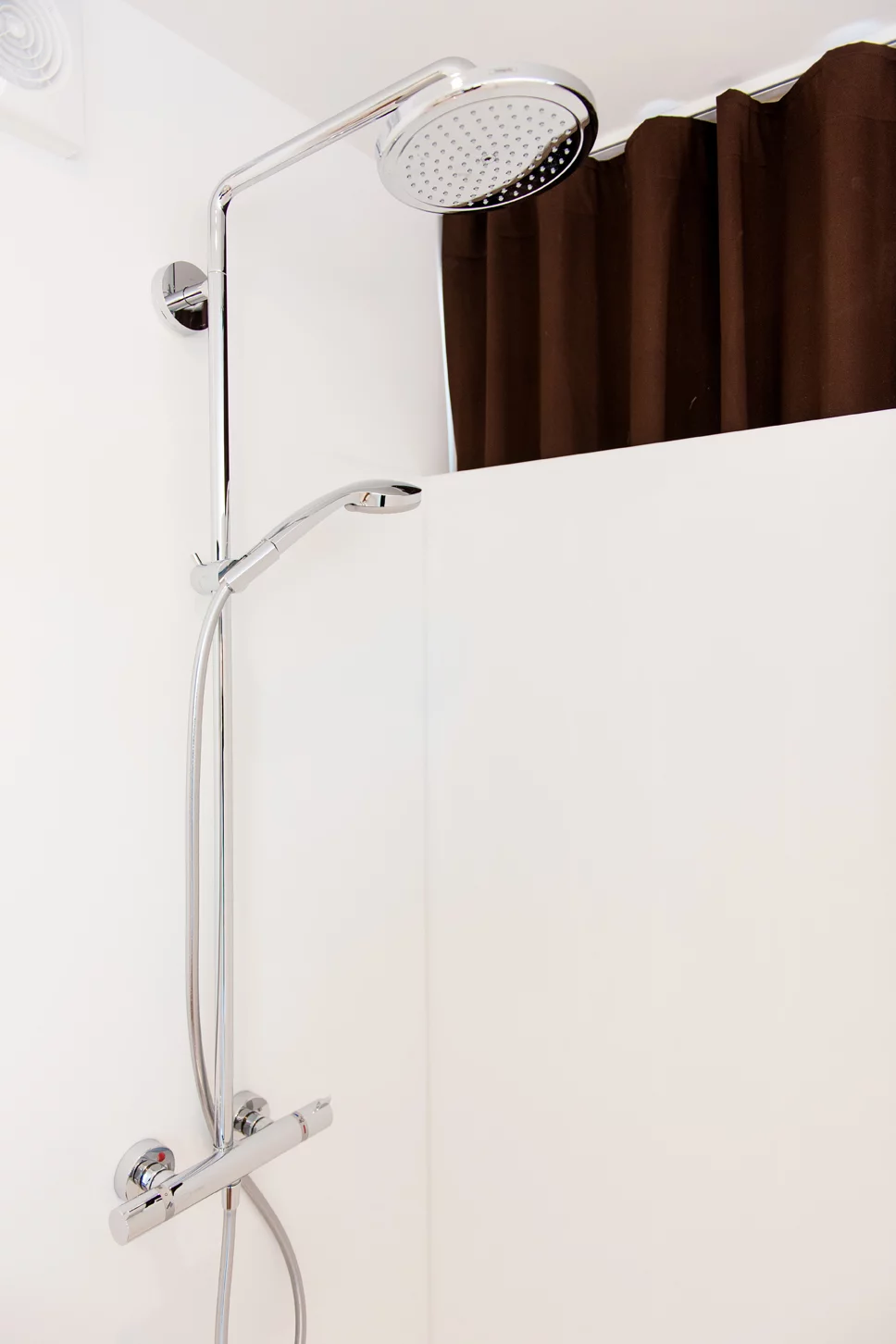 Each 20-foot long guest room has enough space for a floating box-spring bed, iPod docking station, air conditioning, and a bathroom area with a toilet and rain shower