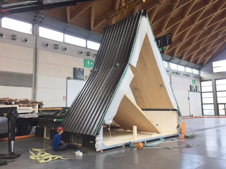 The building's A frame structure and unique folding ability, allows the home to be prefabricated off site, flat-packed and transported via truck or container to its designated site