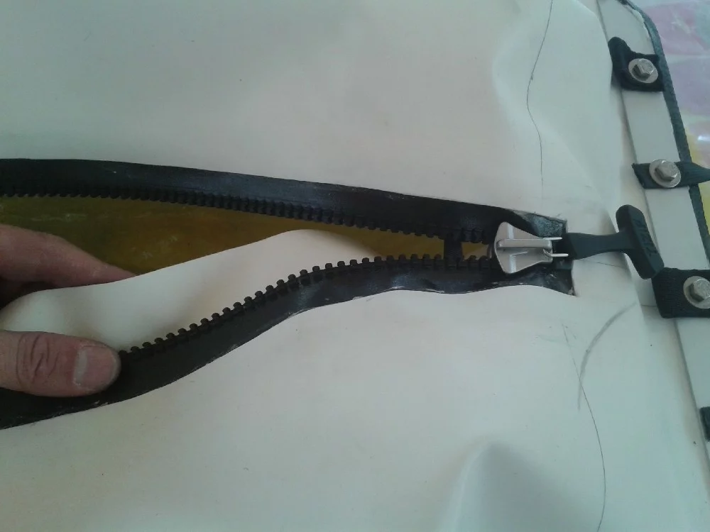 The PVC deck includes a waterproof zipper for watertight gear protection