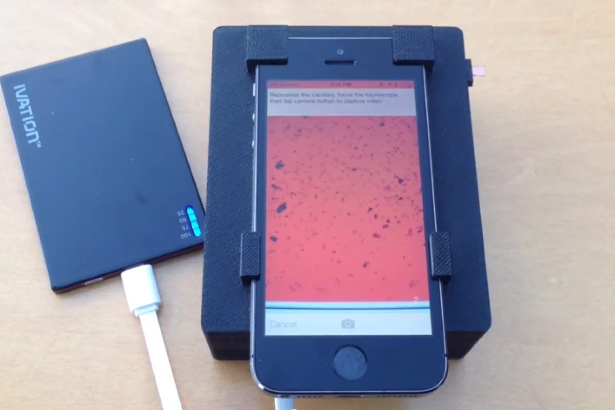 Sliding a smartphone into the base and loading it with a single drop of blood, users can conduct an analysis of the sample in around two minutes