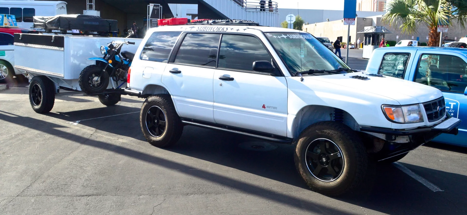 This rig includes a Yakima roof-top tent on the trailer and a mini-bike for tighter riding
