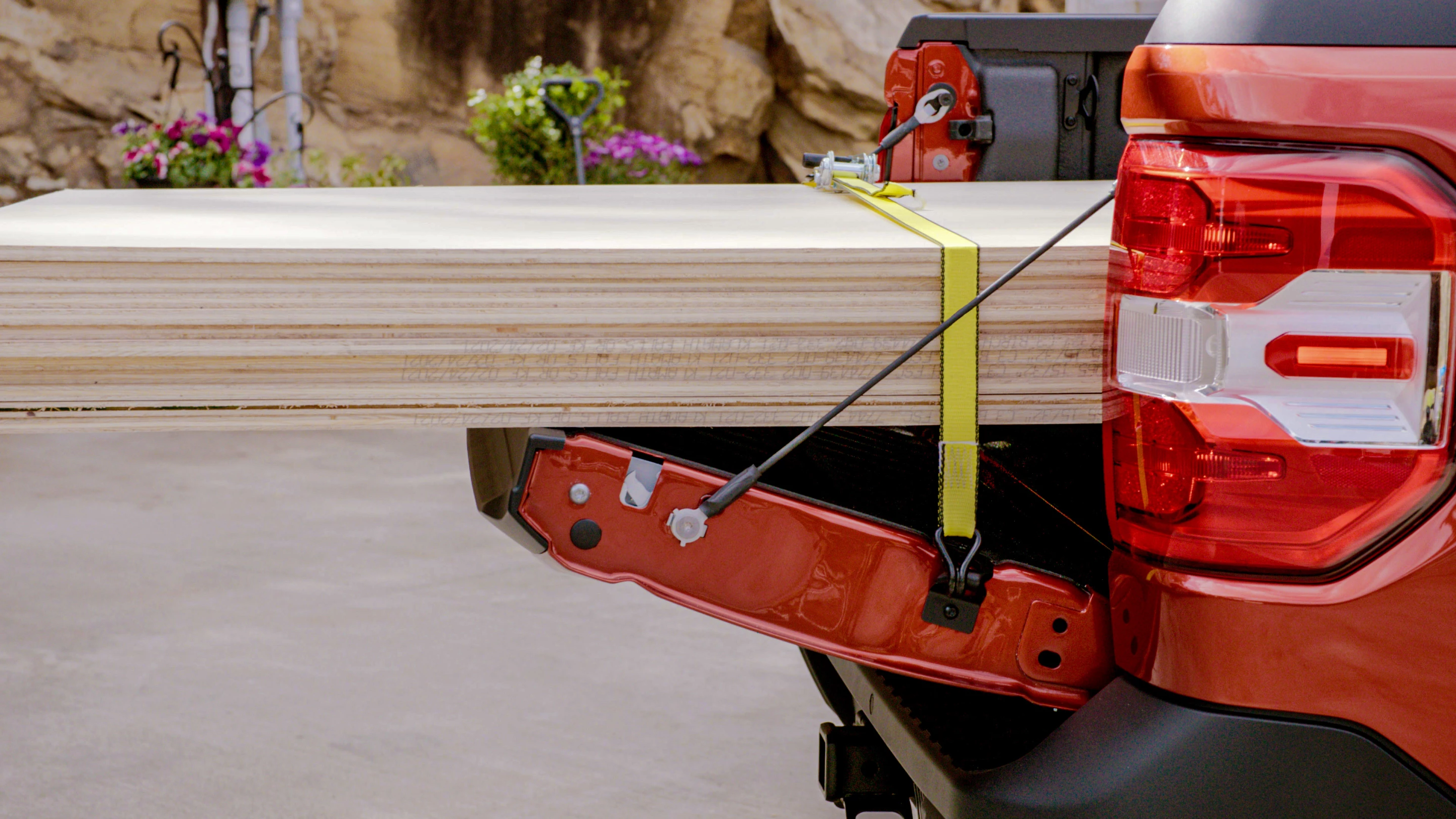 The tailgate tethers can be hooked higher to lift the tailgate so its top lip is even with the wheel wells, allowing full sheets of plywood and the like to be laid flat into the Maverick's bed