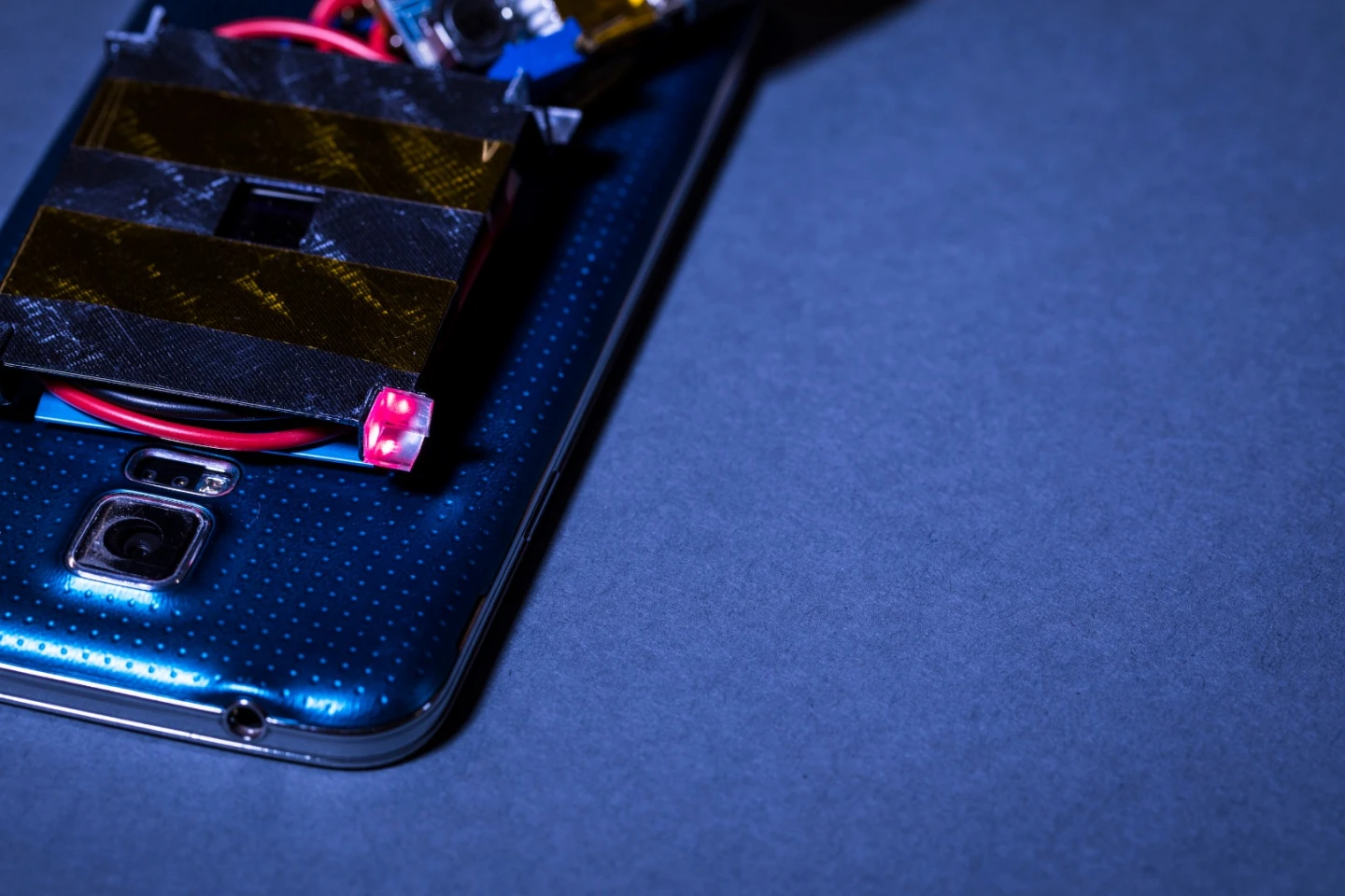The red cube is one of the retroreflectors, which bounces the guard beam back to the emitter to prevent people from walking through the charge beam