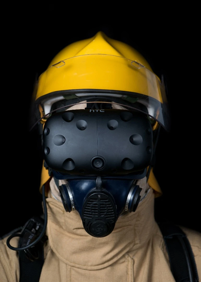 The headgear of the FLAIM system includes an HTC Vive headset and a custom breathing apparatus