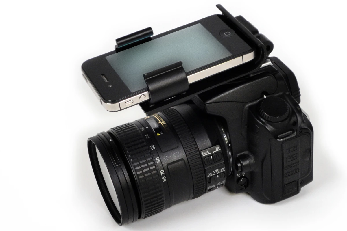 The Flash Dock from Pocket Demo provides a physical connection between your iPhone and DSLR camera via the latter's hot shoe socket, providing ready access to your library of photography apps