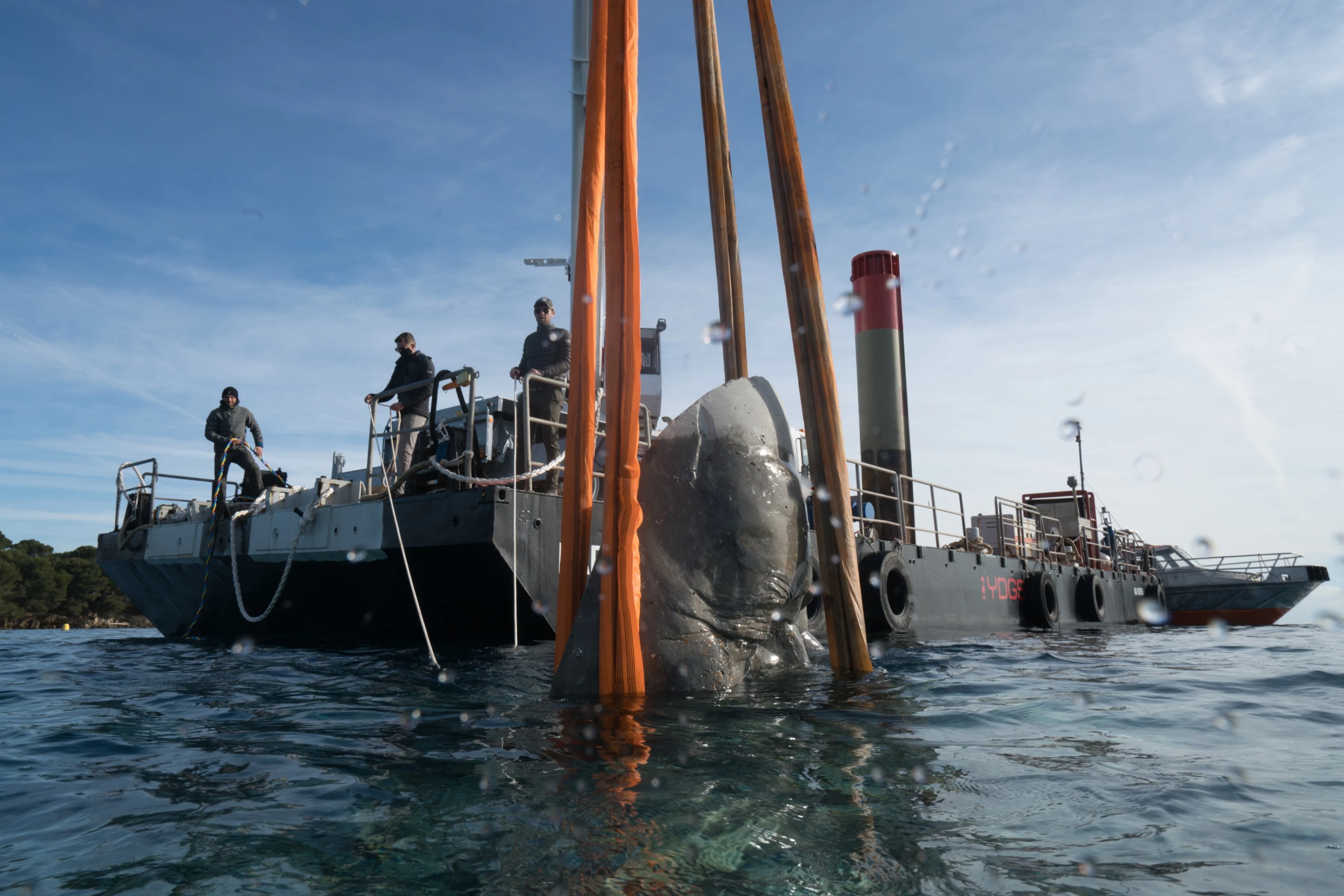 The Underwater Museum of Cannes' sculptures were floated out to the site using boats