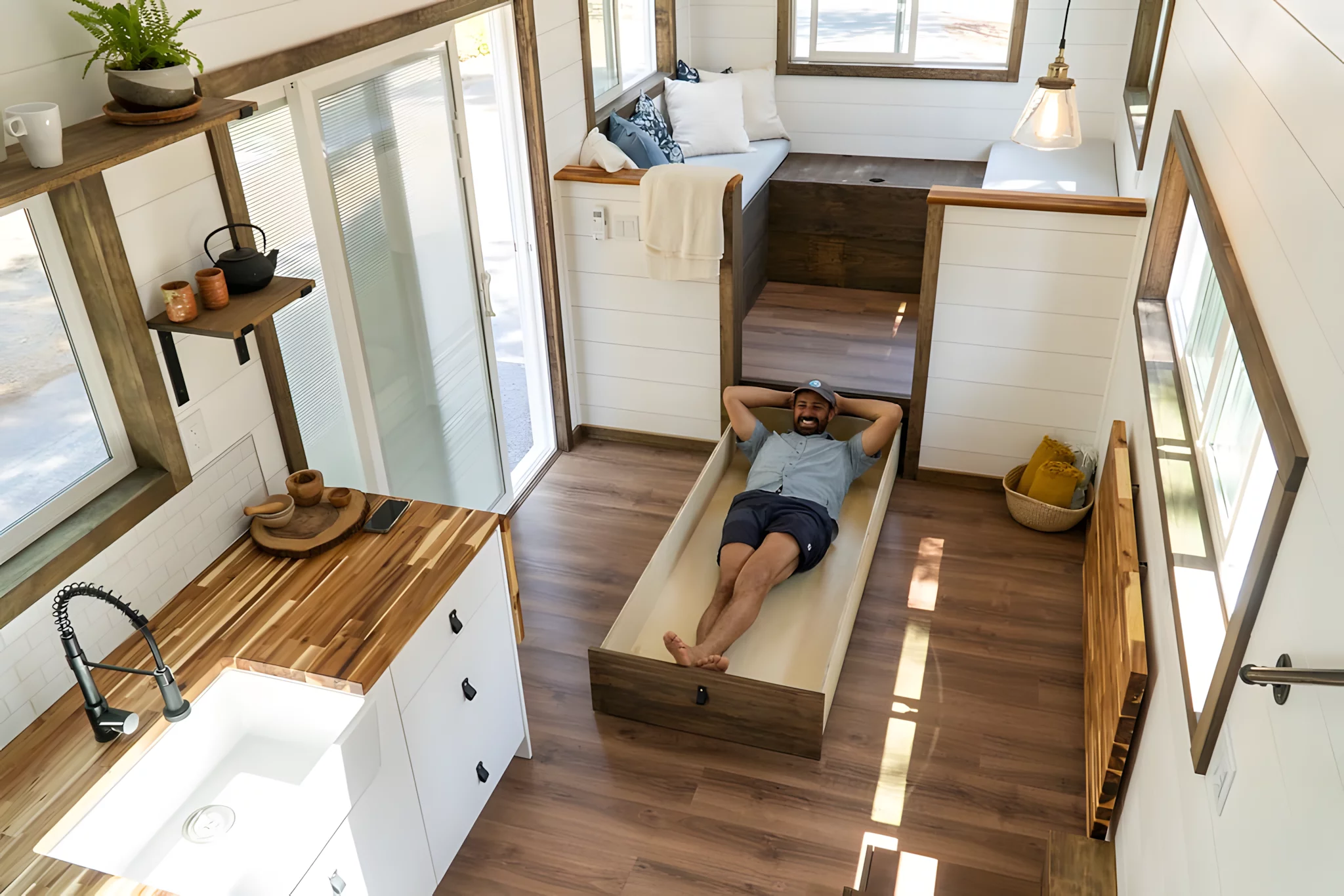 Thanks to its raised position, the Olympic's living room has lots of storage space available