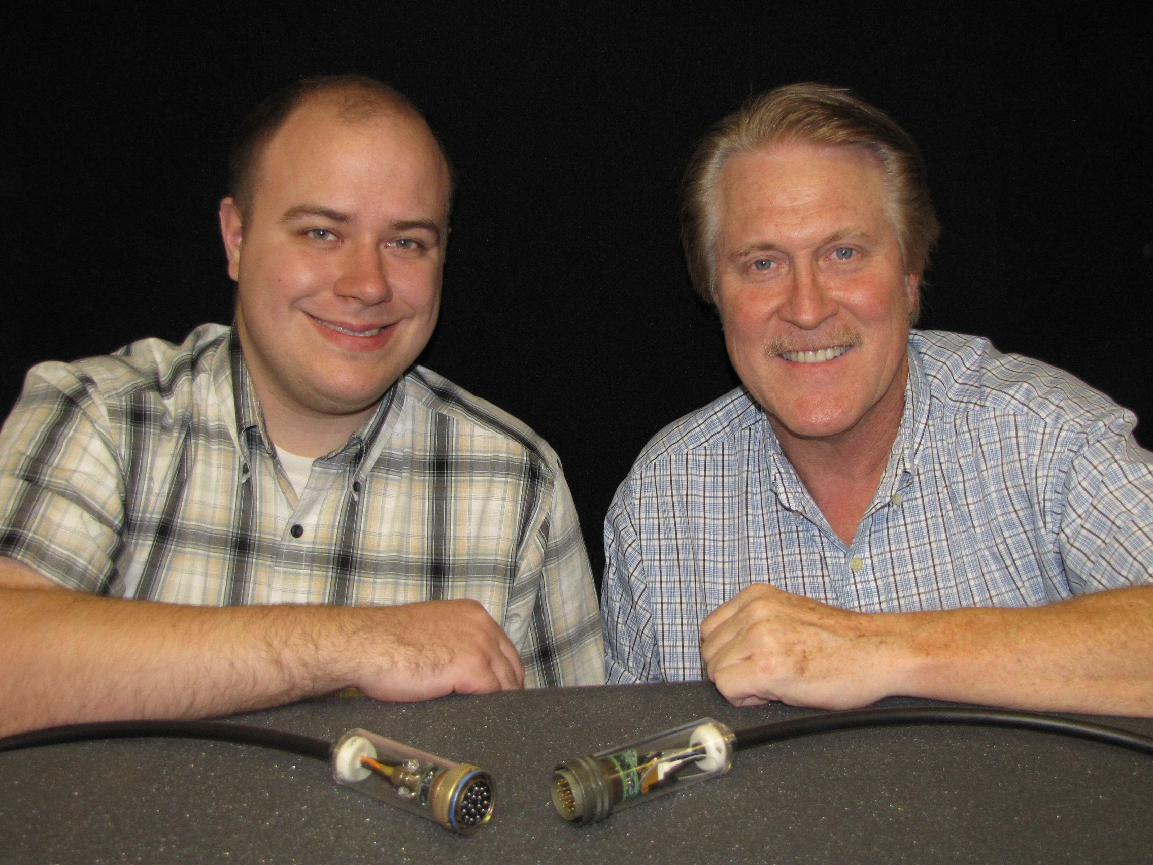Titus Appel (left) and Steve Sanderson, with their power-over-fiber communications cable