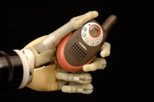 The iLimb hand, from Touch Bionics, demonstrating its ability to conform its grip to suit irregular objects.