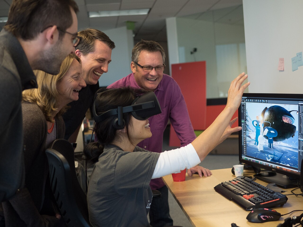 Eric Darnell (in background), Maureen Fan (in VR headset), and the Baobab Studios team