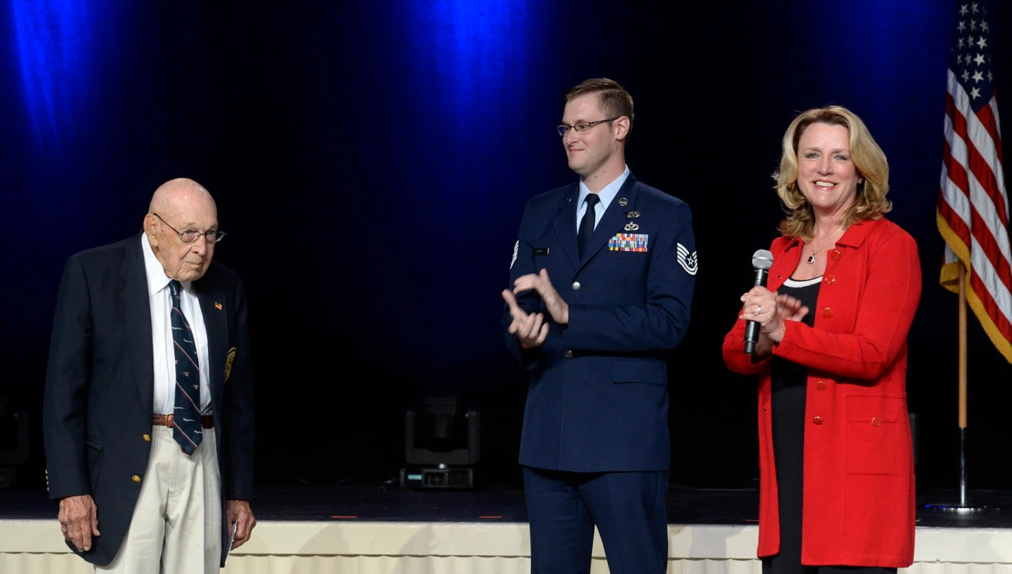 Air Force Secretary Deborah Lee James announces the name of the Air Force's newest bomber, the B-21 Raider, with the help of retired Lieutenant Colonel Richard Cole, one of the Doolittle Raiders, and Technical Sargent Derek White
