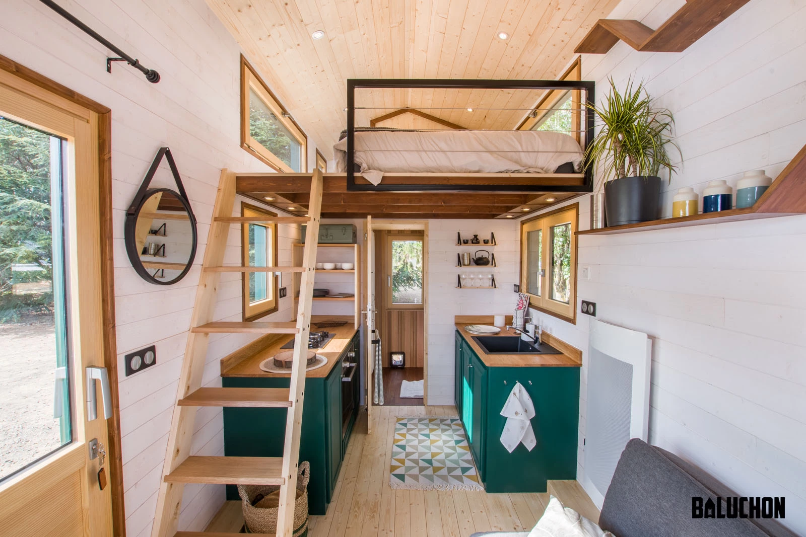 The Hauméa tiny house includes a sofa bed on the ground floor and both a double bed and a single bed upstairs