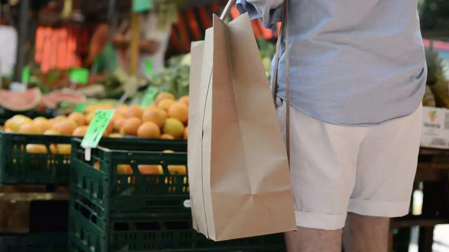 The PaperJohn is a standard 320 x 170 x 450 mm (12.6 x 6.7 x 17.7 in) block-bottomed paper bag with long shoulder straps added