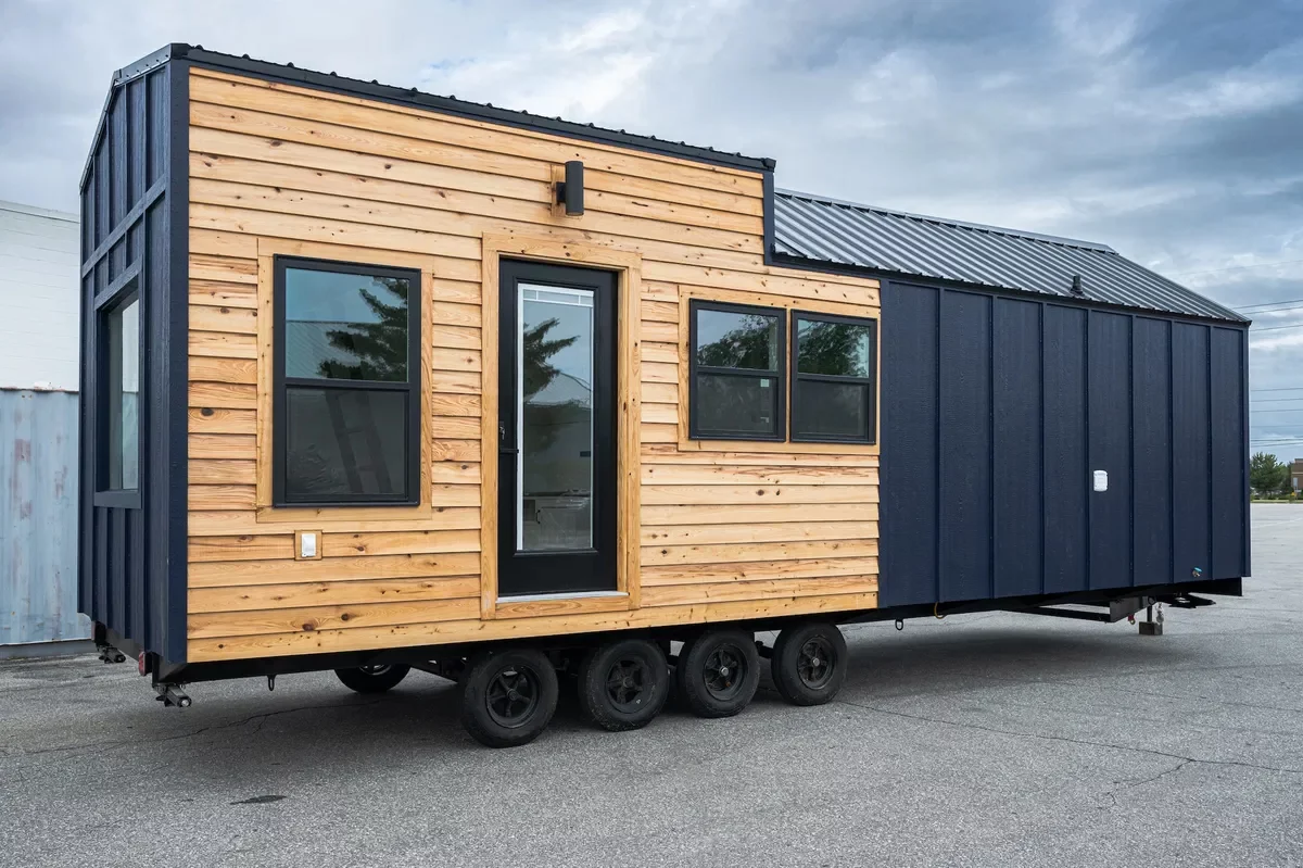The Mondo is finished in wood and cement board siding, and is topped by a steel roof