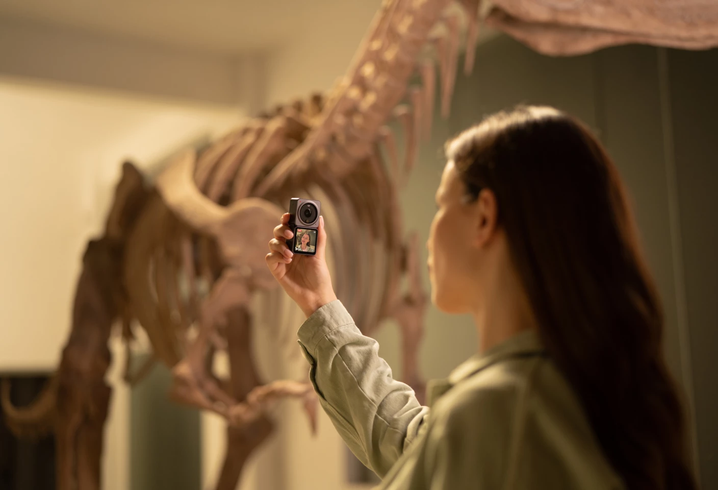 DJI extends functionality through magnetically attached modules, such as the extra display for selfie moments
