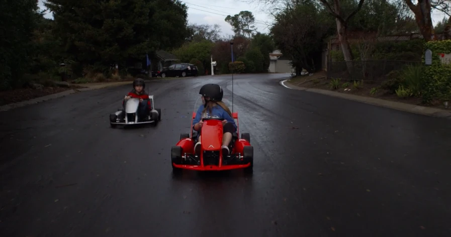 Two Smart-Kart drivers on the road