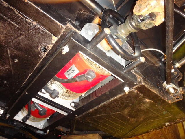 The two motors are mounted in series inside a box steel cradle