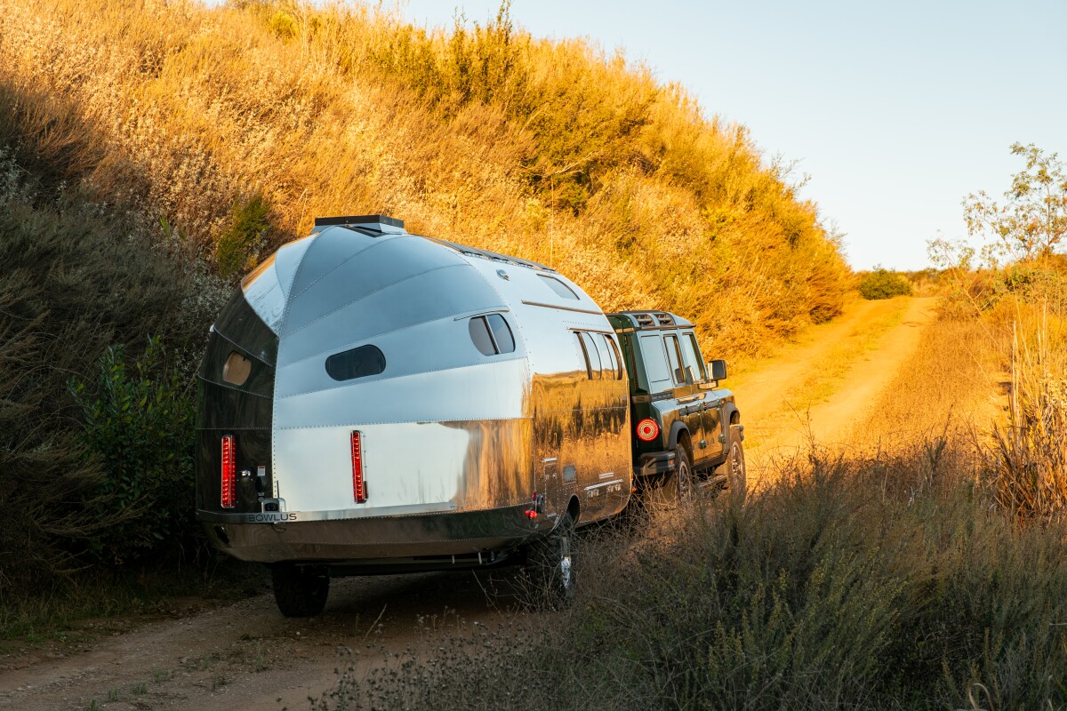 Frontier-smashing camper hides rustic lodge inside shimmering shell