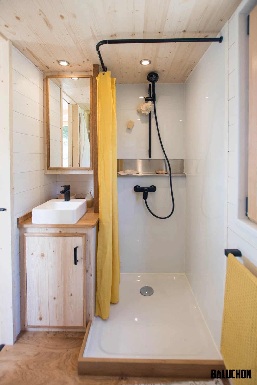 The Midgard's bathroom includes a shower, sink, and toilet