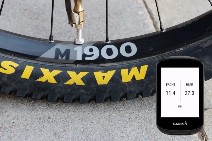 A Garmin cyclometer app displays air pressure readings from front- and rear-tire Outrider sensors
