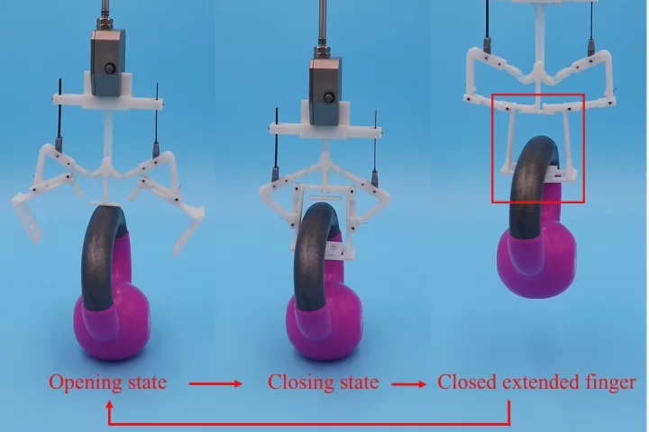 The MIP gripper grasps and lifts a 5-lb (2.3-kg) kettlebell