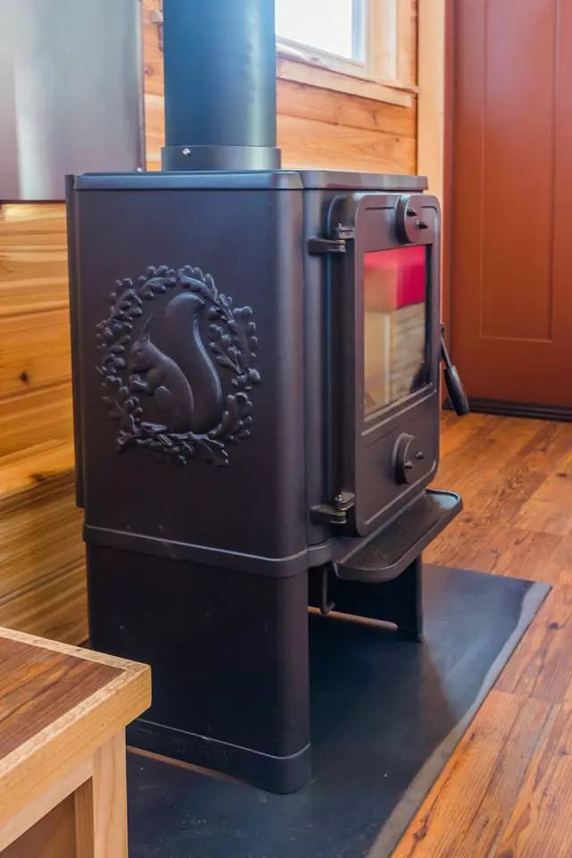 The wood burner in Davis's 22 ft Off-Grid Tiny Home