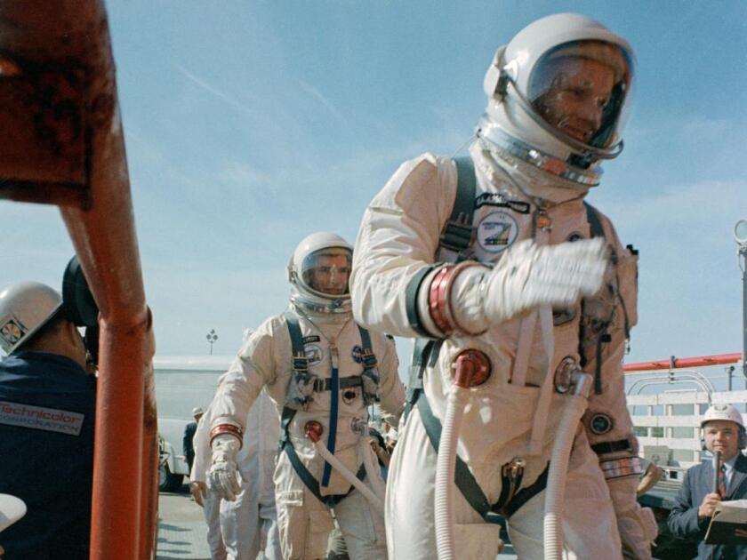 Commander Neil Armstrong (right) and pilot David R. Scott prepare to board the Gemini-Titan VIII (Photo: NASA)