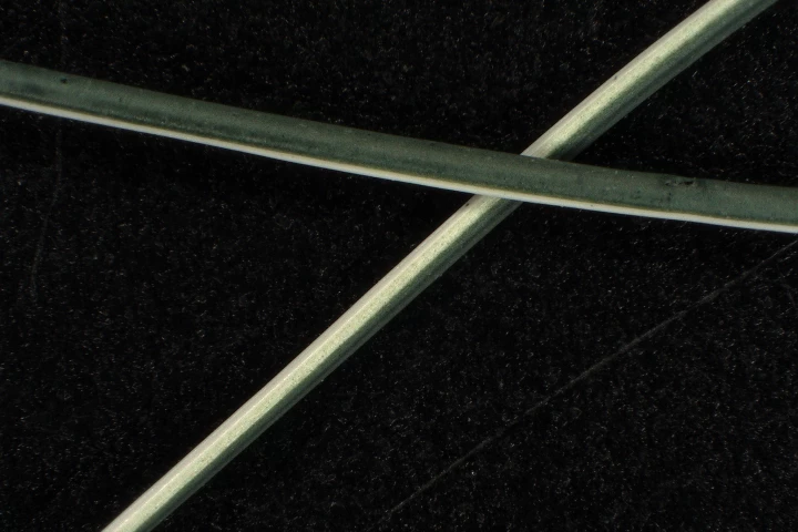 A couple of the fibers, which are cotton on one side and conductive polymer on the other