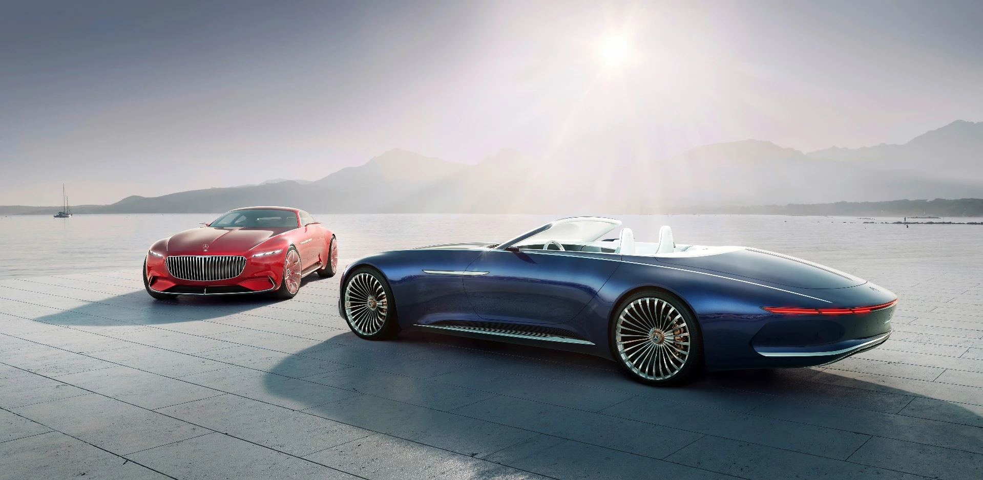 The 2017 Vision Mercedes-Maybach 6 Cabriolet (at right) and the Vision Mercedes-Maybach 6 Coupé presented at Pebble Beach in 2016 (at left)