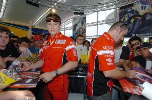 Xerox Ducati team-mates James Toseland and Regis Laconi signing autographs