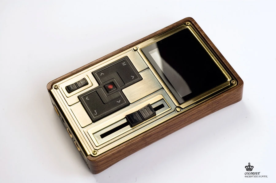 An OLED display is joined by deliciously old-school physical buttons and sliding volume pots on the front of the player